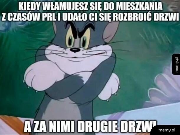Kot Tom z bajki Tom i Jerry zadowolony z załozonymi rękami